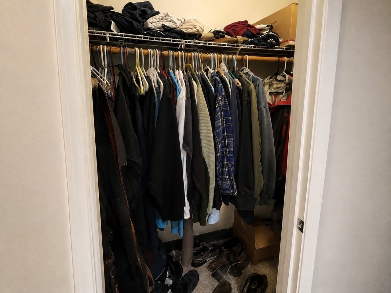 A cluttered reach-in closet before its AI redesign