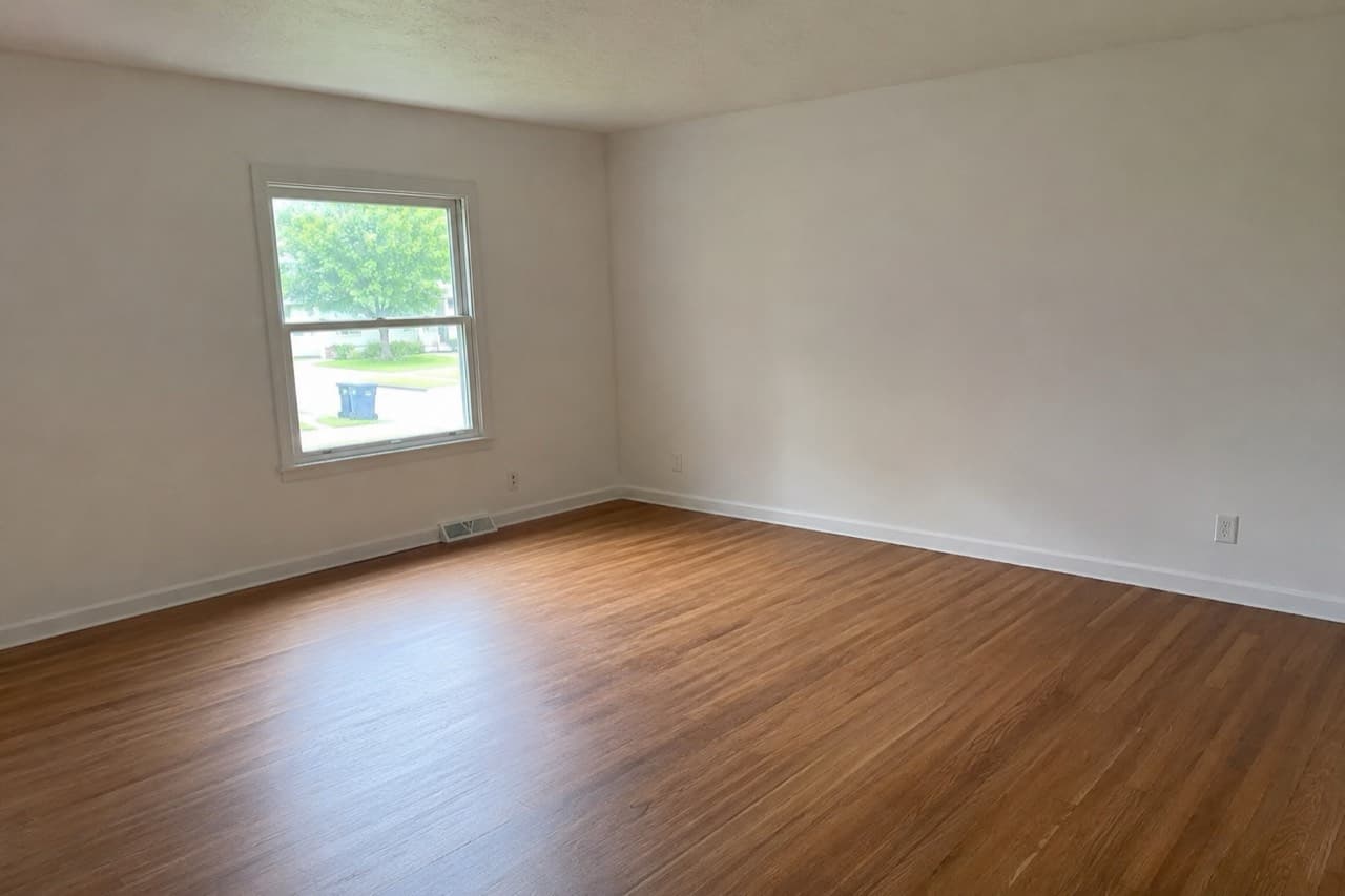 An empty living room before virtual staging